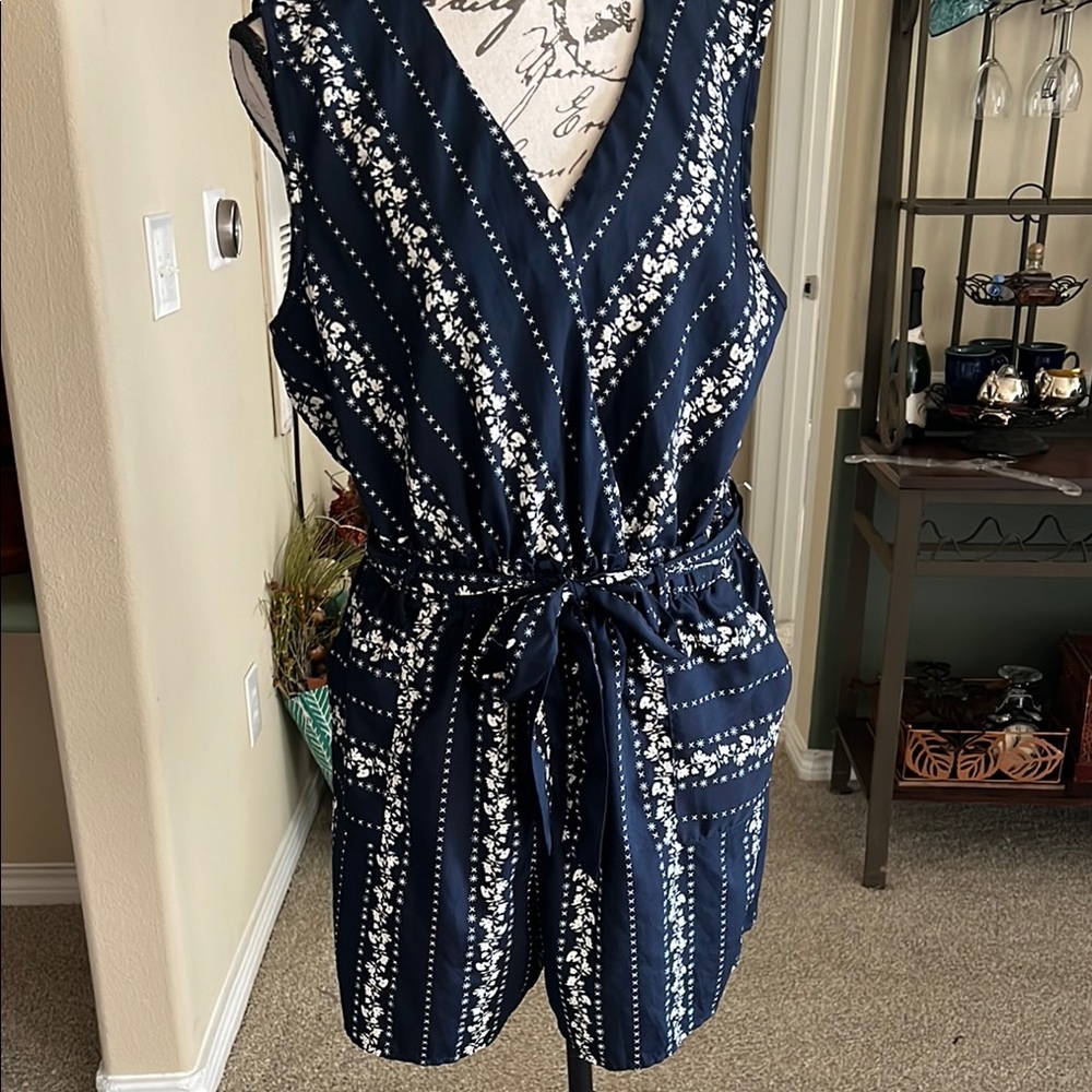 Navy Sleeveless Floral Romper with Pockets. Thin and light. Worn once.